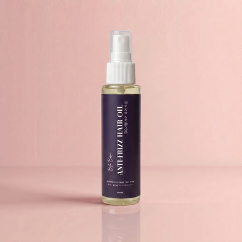 Bottle of Antifrizz Hair Oil on a pink background