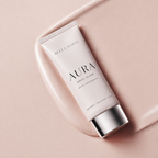 Bella Borne Aura Daily Glow tube on a pink background